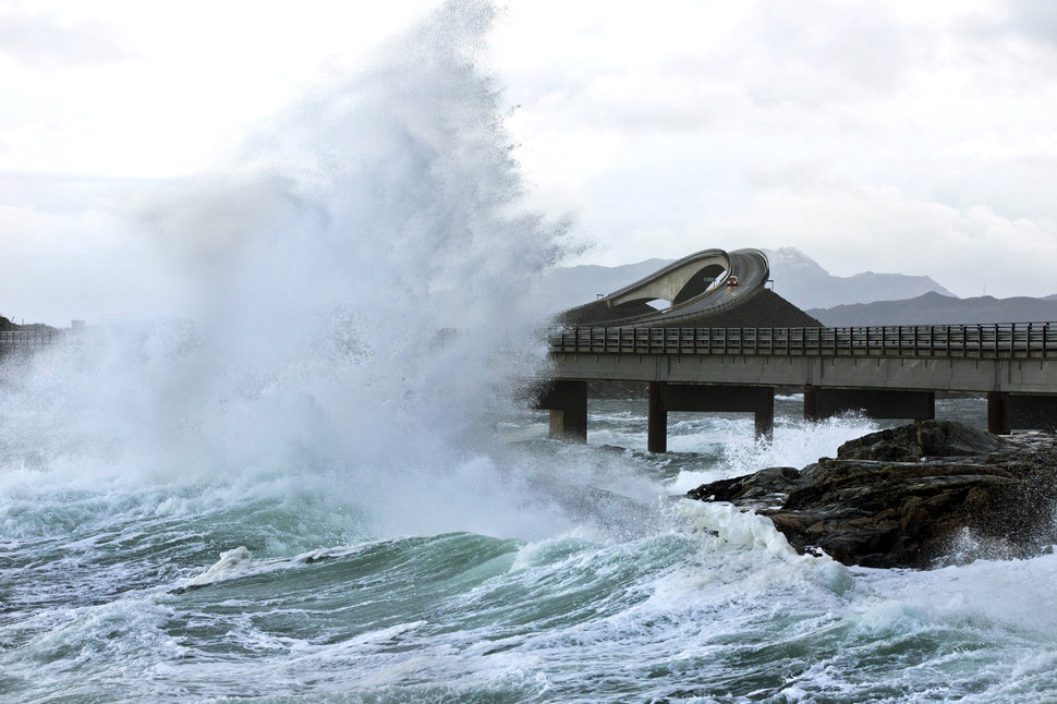 A picture taken on November 26, 2011 shows a giant wave over the Atlantic Road in Averøy, Norway as the storm "Berit" struck the Norwegian coast. Norwegian rescuers were hunting Monday for two members of a film crew swept away by a giant wave as they were filming a killer weekend storm, rescue officials said on November 28, 2011. The pair, who are now presumed dead, went missing on November 27, 2011 on the southwestern coast of the country, where swells reached up to 20 metres (65 feet). A third crew member managed to swim ashore and alert emergency crews, rescue officials said. AFP PHOTO / SCANPIX NORWAY - BERIT ROALD (Photo credit should read BERIT ROALD/AFP/Getty Images)